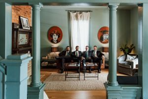 Groomsmen getting ready for a wedding at Guest House Raleigh