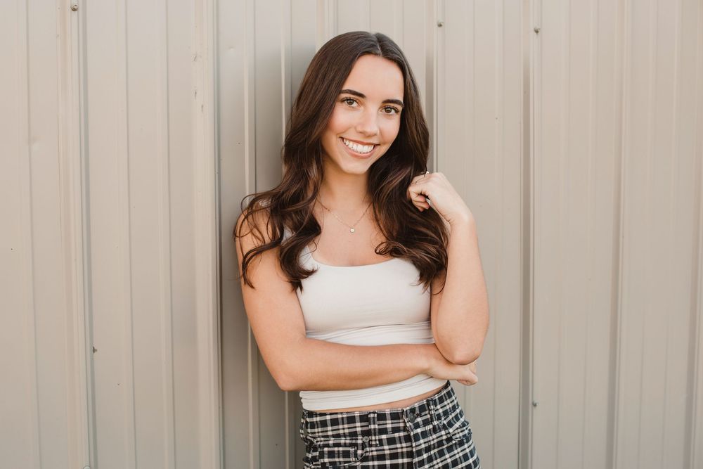 Modern lifestyle portraits against neutral metal wall background.