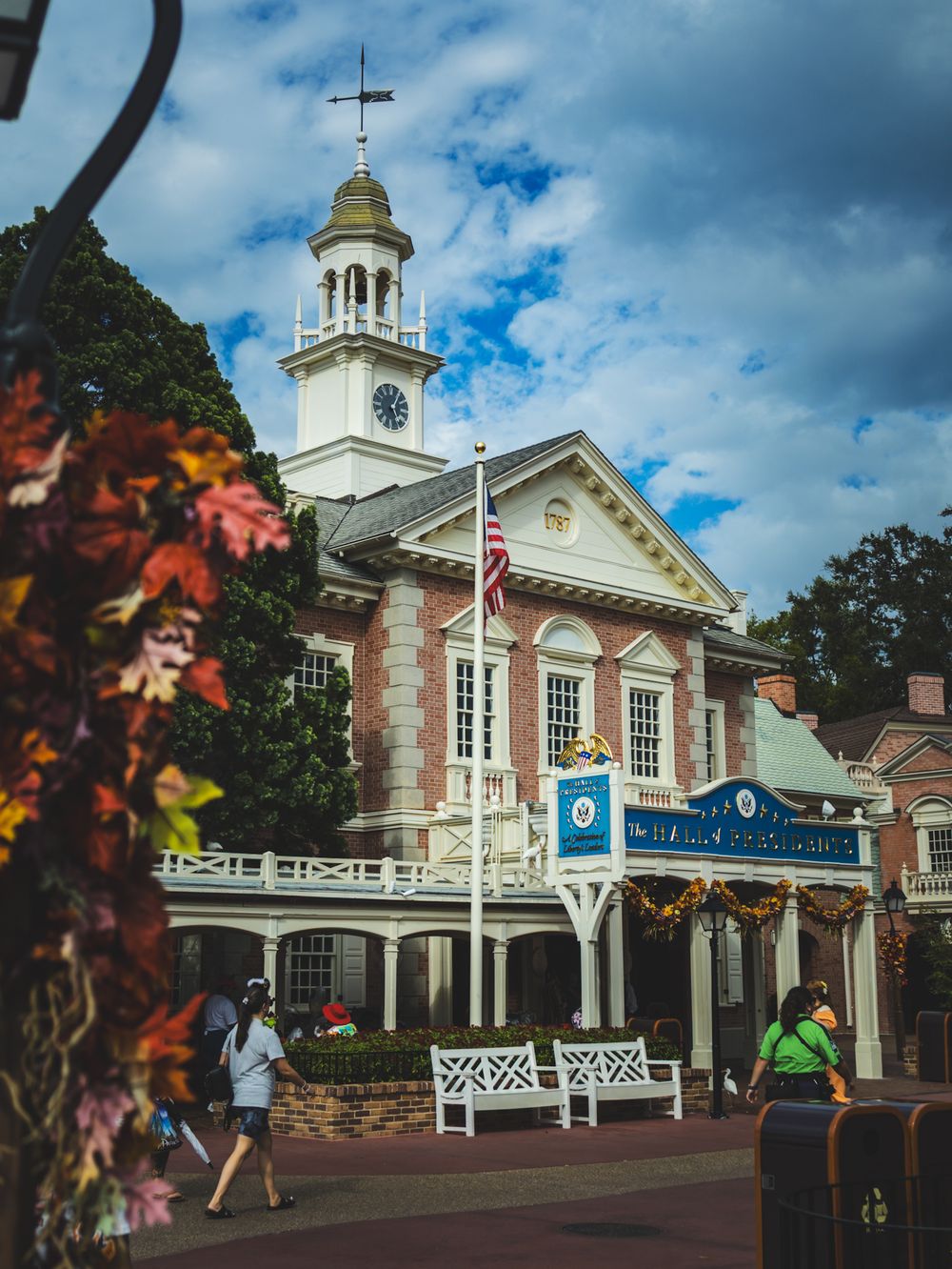 Colonial-style Liberty Square building with clock tower and white columns at Disney World.