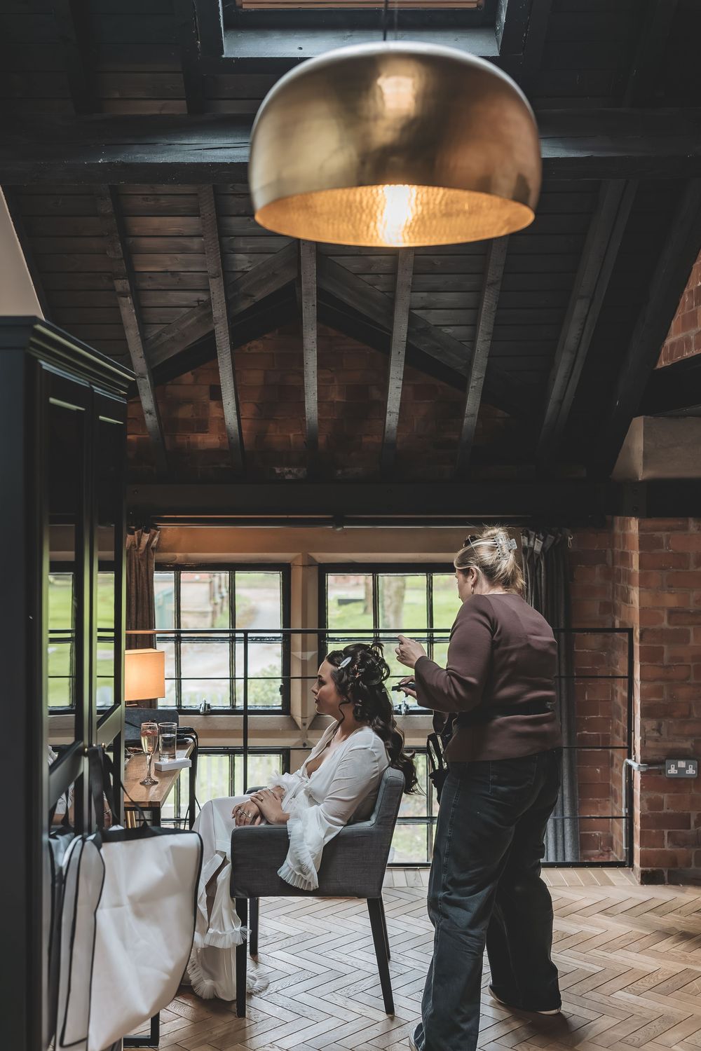 Unobtrusive wedding photography of hair and make up of a bride on her wedding morning in a Nottinghamshire wedding venue.