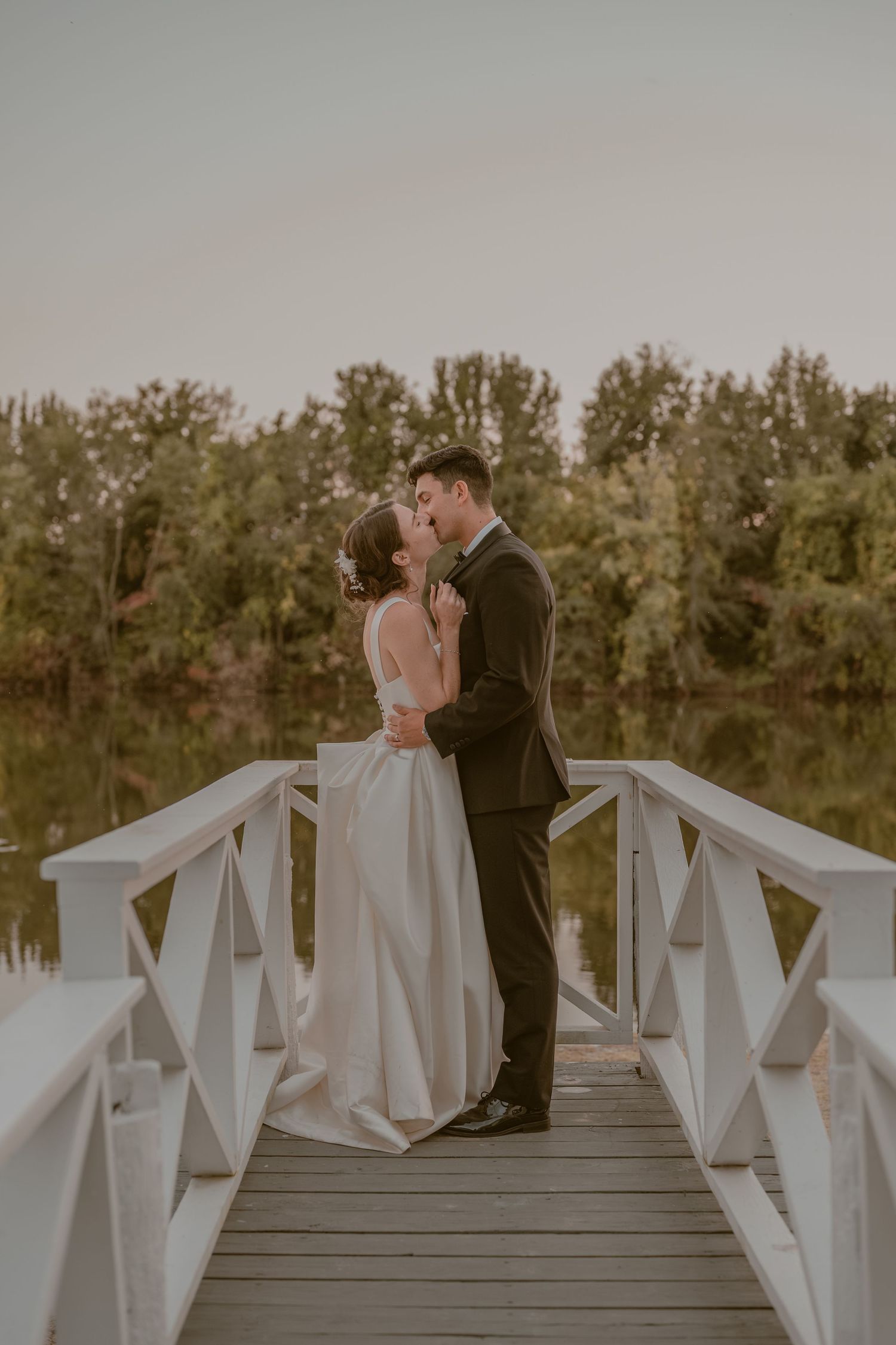 Bride and groom embracing during golden hour at Gaie Lea, Staunton, VA, playful, intimate, storytelling portraits.