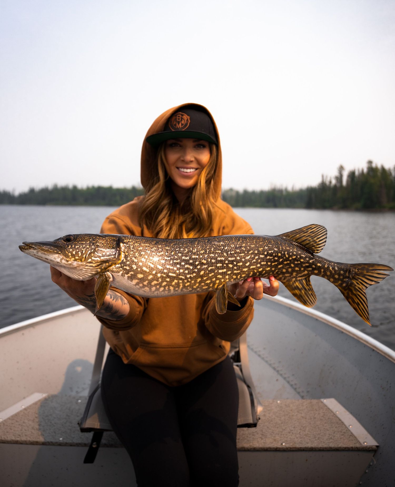 Large northern pike caught while fishing on a lake.