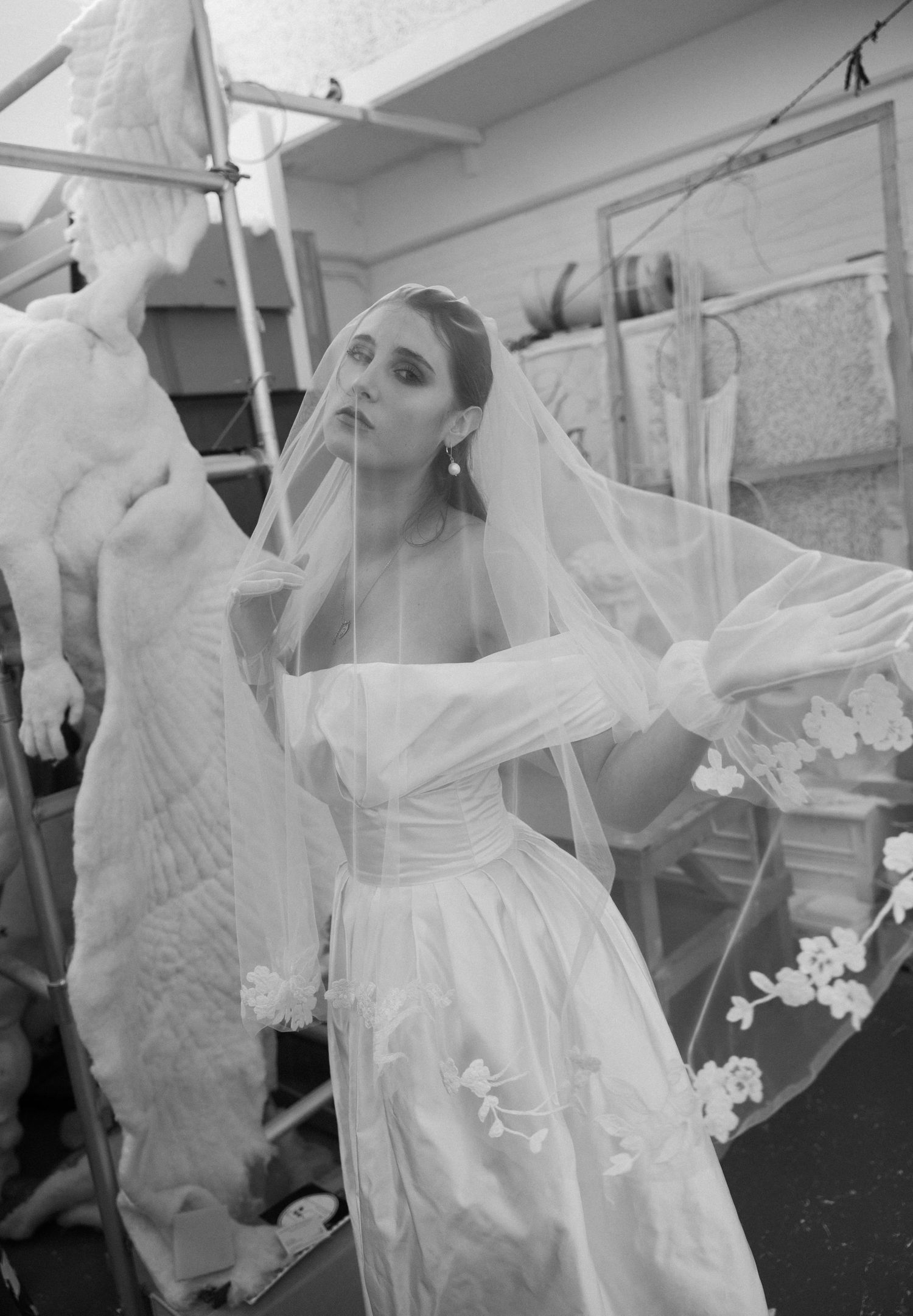 Black and white series showing flowing bridal veil movements in dramatic style.