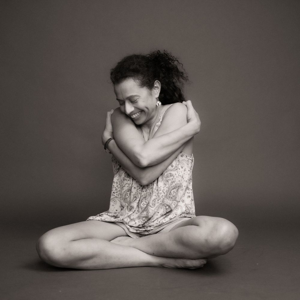 Black and white artistic portrait series showing graceful dance-inspired poses in minimalist studio setting.