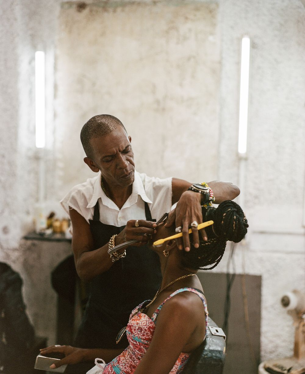 Interior scene of a hair salon with vintage styling equipment.