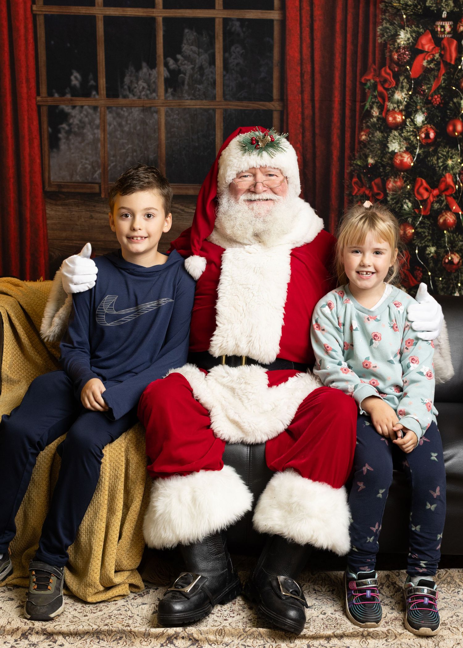 A series of four holiday photos showing children sitting with Santa Claus on a decorated chair against a red backdrop.