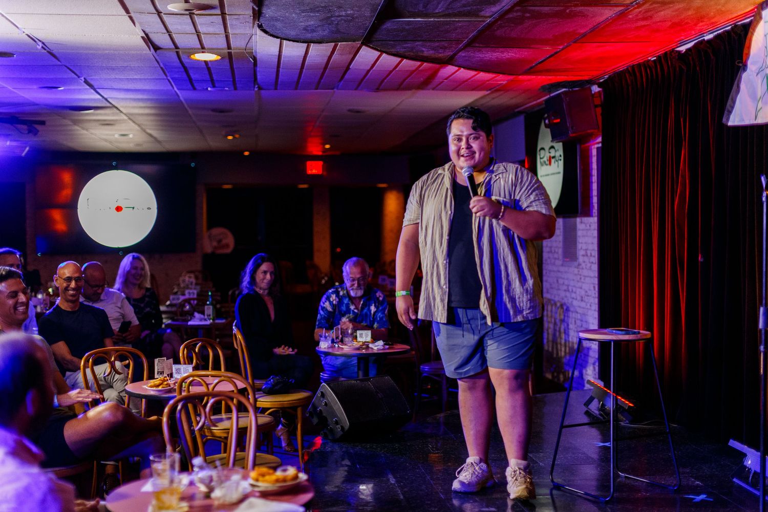 Comedian on stage at a comedy show. San Juan, Puerto Rico.