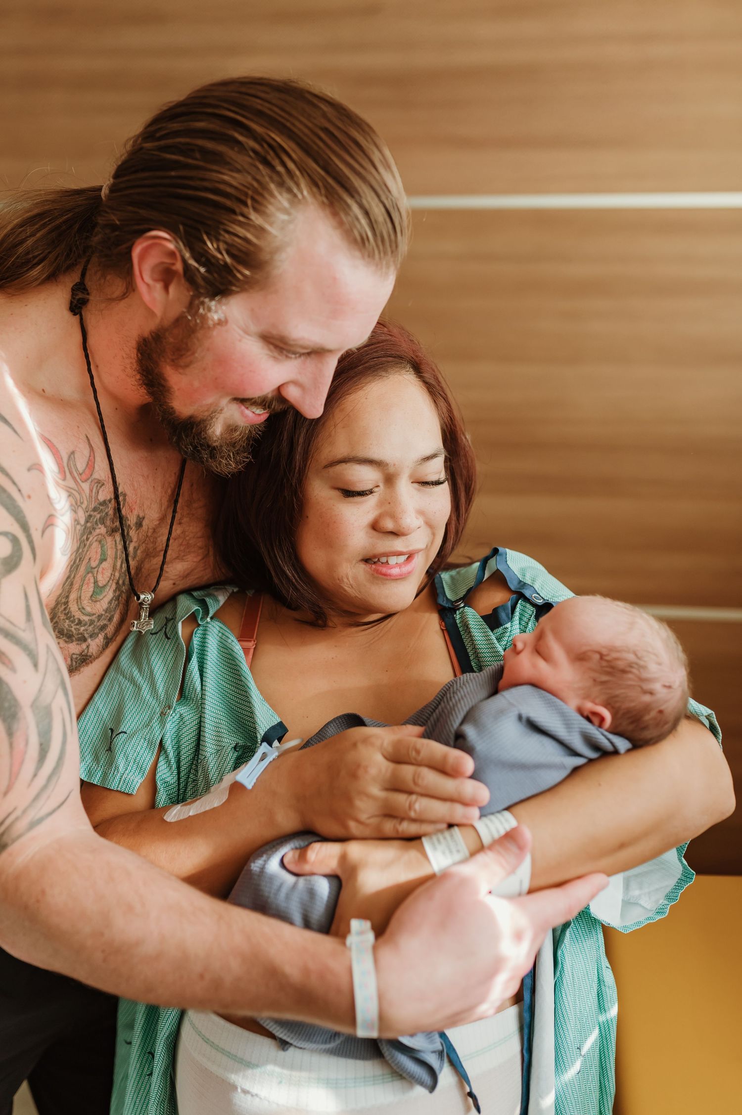 Parents share tender moments with their newborn baby in a series of intimate hospital photos.