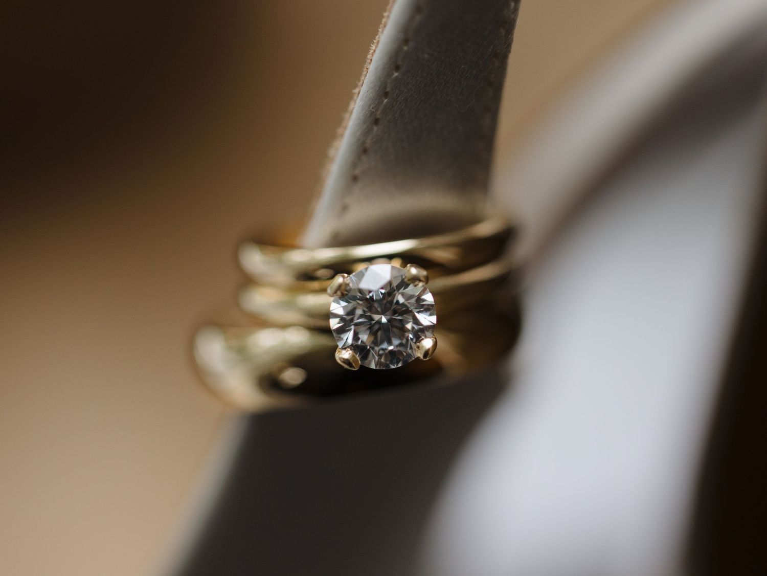 Close-up macro photos of diamond engagement rings from multiple angles showing sparkle and detail.