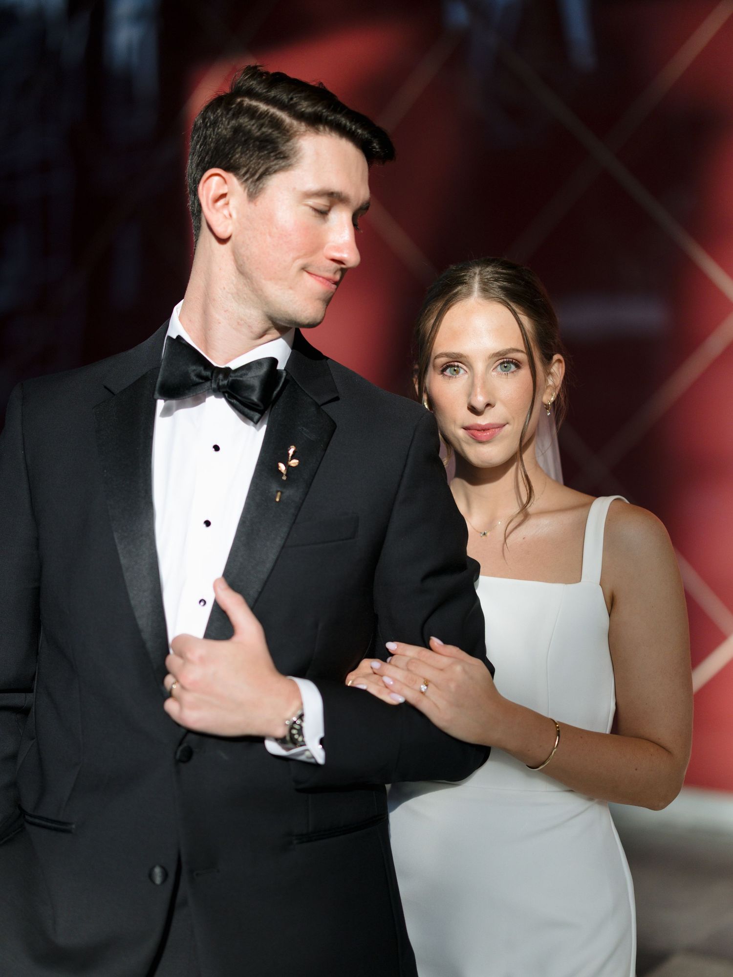 Elegant couple in formal wedding attire share intimate moments during their photo session.
