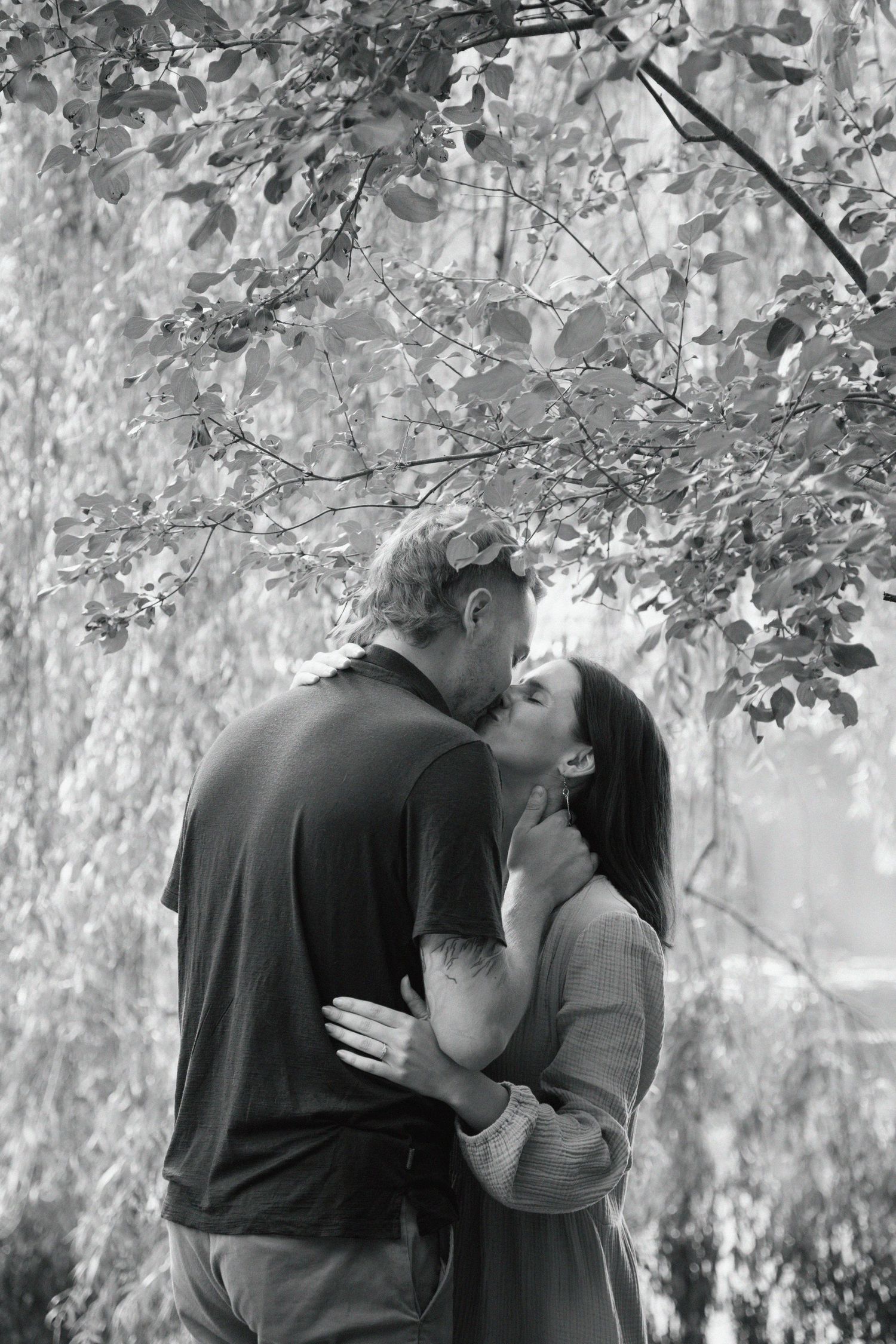 Wedding photographer capturing first kiss at intimate ceremony.