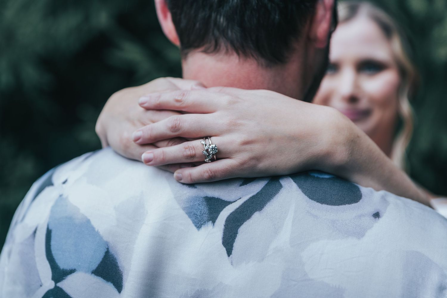 Natural wedding photography of newlyweds holding each other.