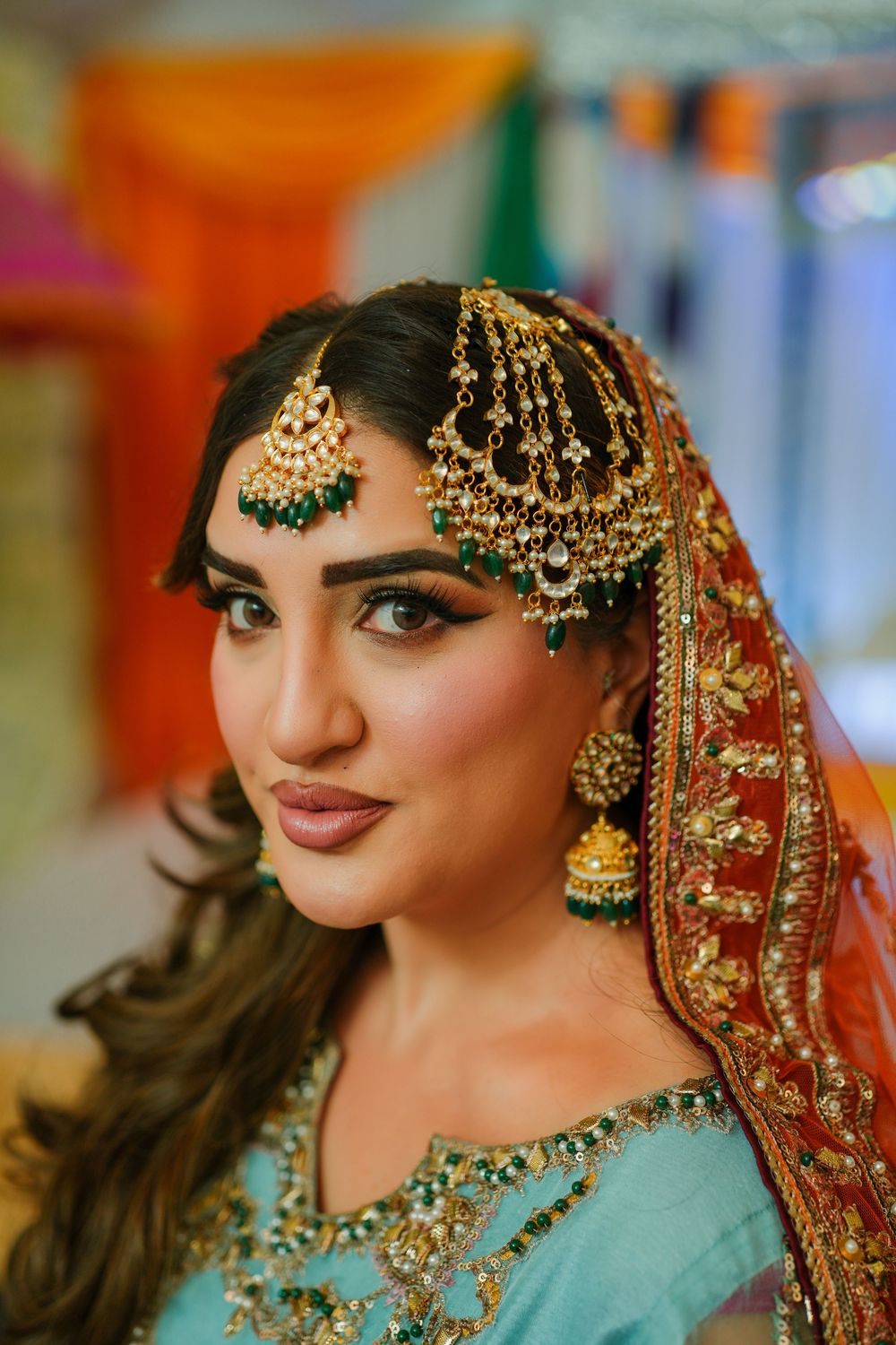Close-up shots of traditional South Asian bridal jewelry and makeup details in turquoise and gold tones.