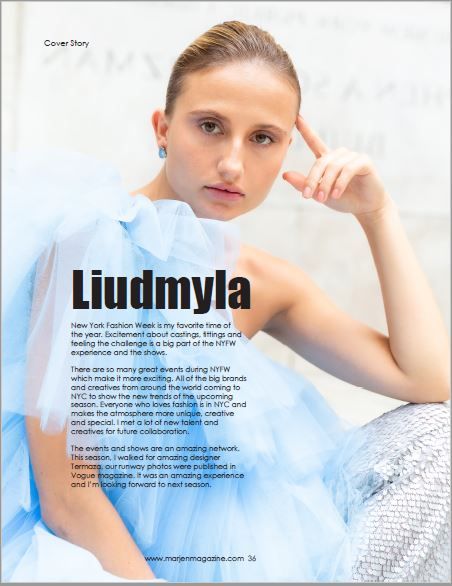 Editorial portrait in soft blue tones with minimal styling.