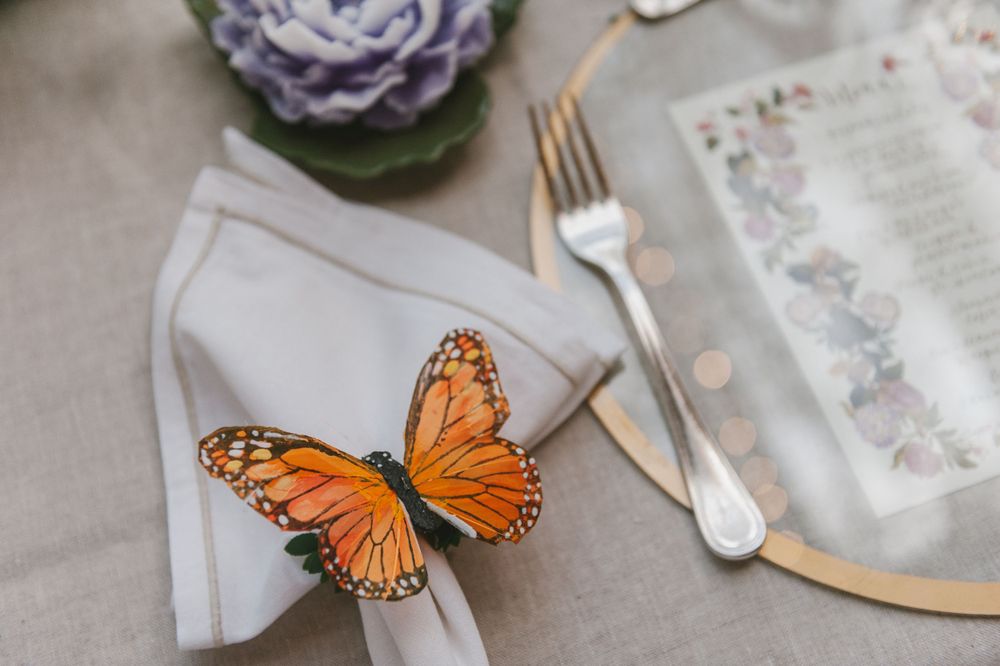 Wedding dinner table decorated with a handmade butterfly.