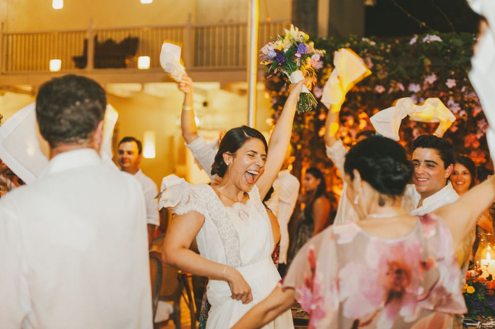 Bride ecstatically smiles as she arrives at her wedding party.