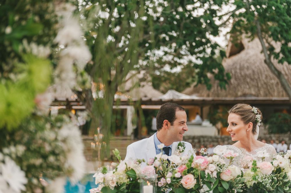 Bride and groom sharing a joke while at their wedding ceremony in Colombia.