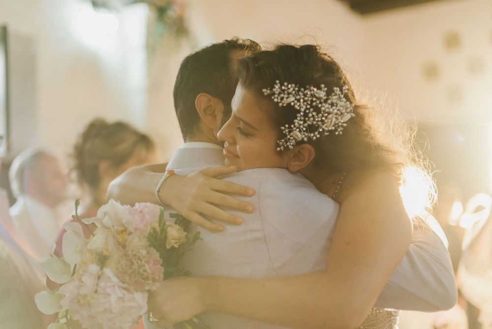 Bride and groom hugging each other during wedding ceremony in Santa Marta