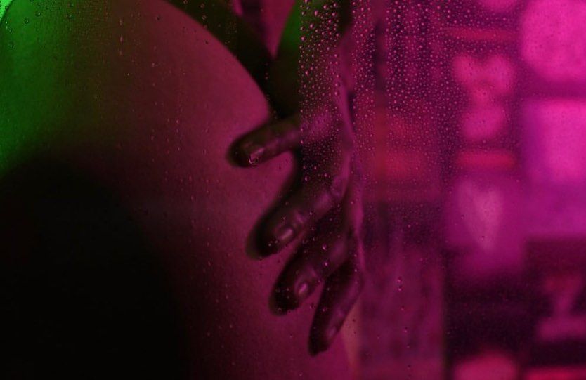 Abstract photography with pink and green gradient lighting.
