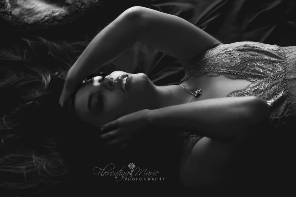 Black and white artistic portrait showcasing dramatic shadows and textures.