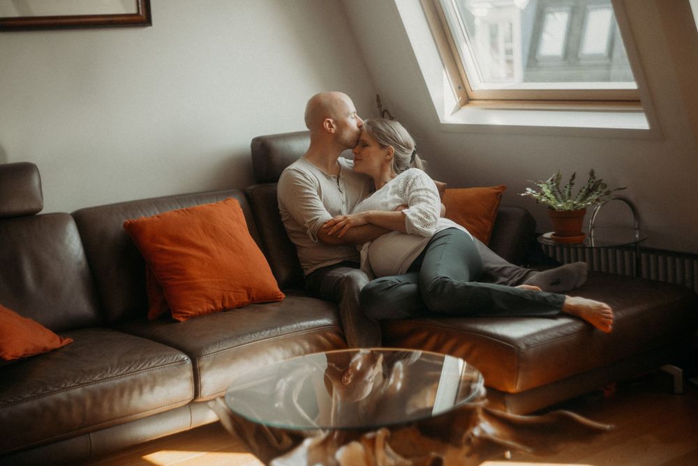 Cozy attic room scene with warm sunlight streaming through windows.