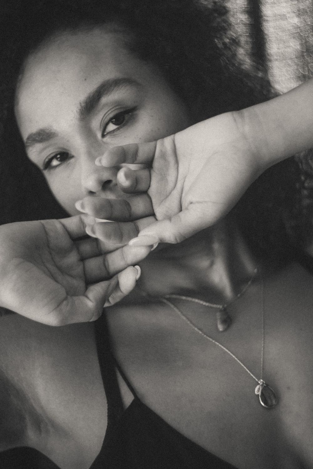 Series of intimate black and white self-portrait style photographs in low light.