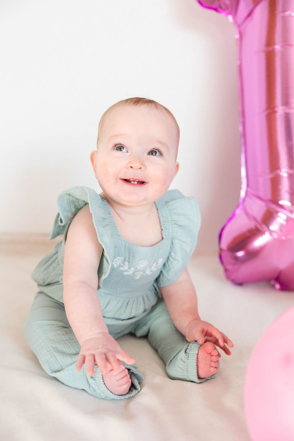 Baby girl first birthday photos with balloons
