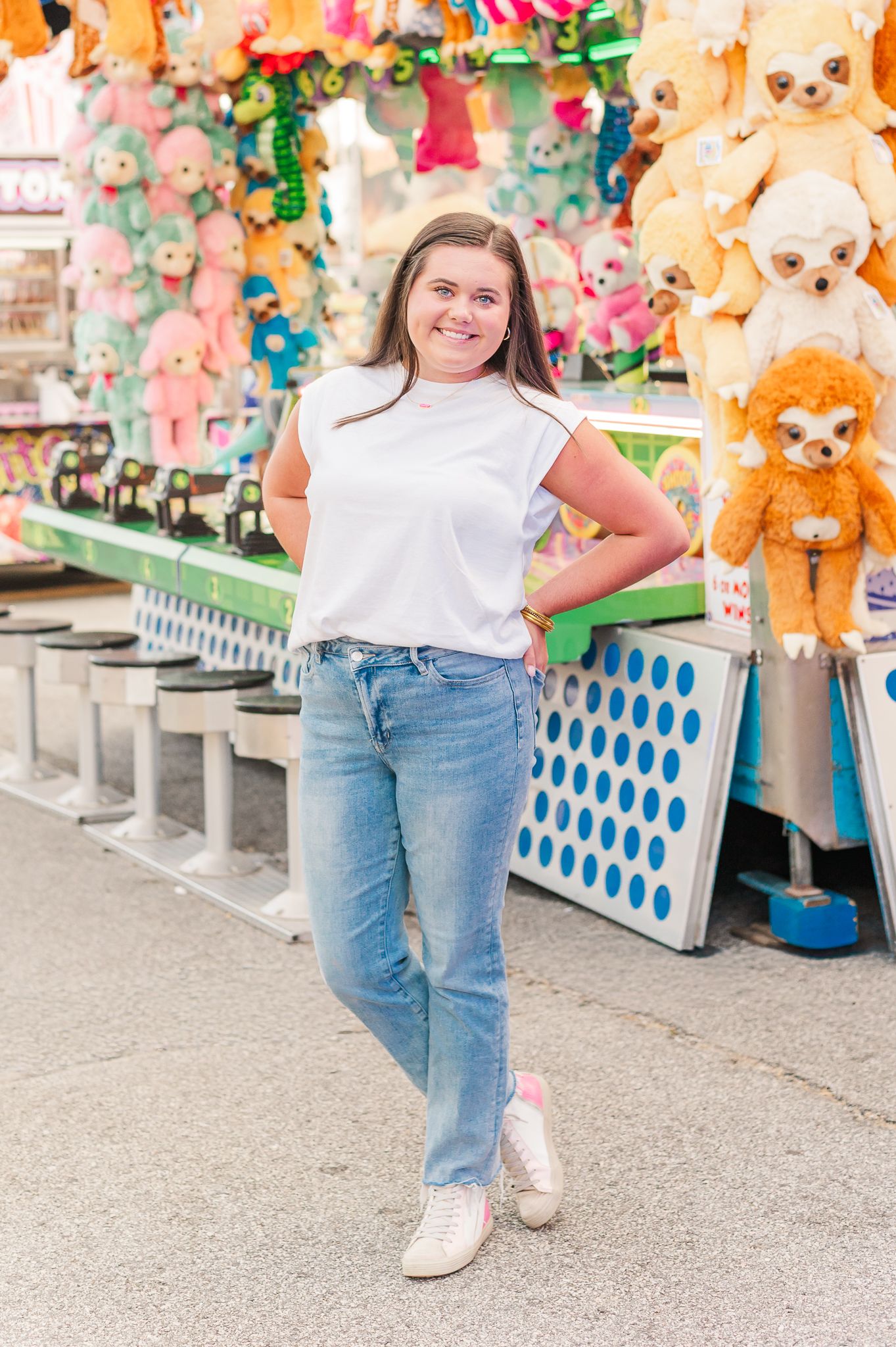 Senior girl posing at the fair in front of game, natural senior session Newnan GA