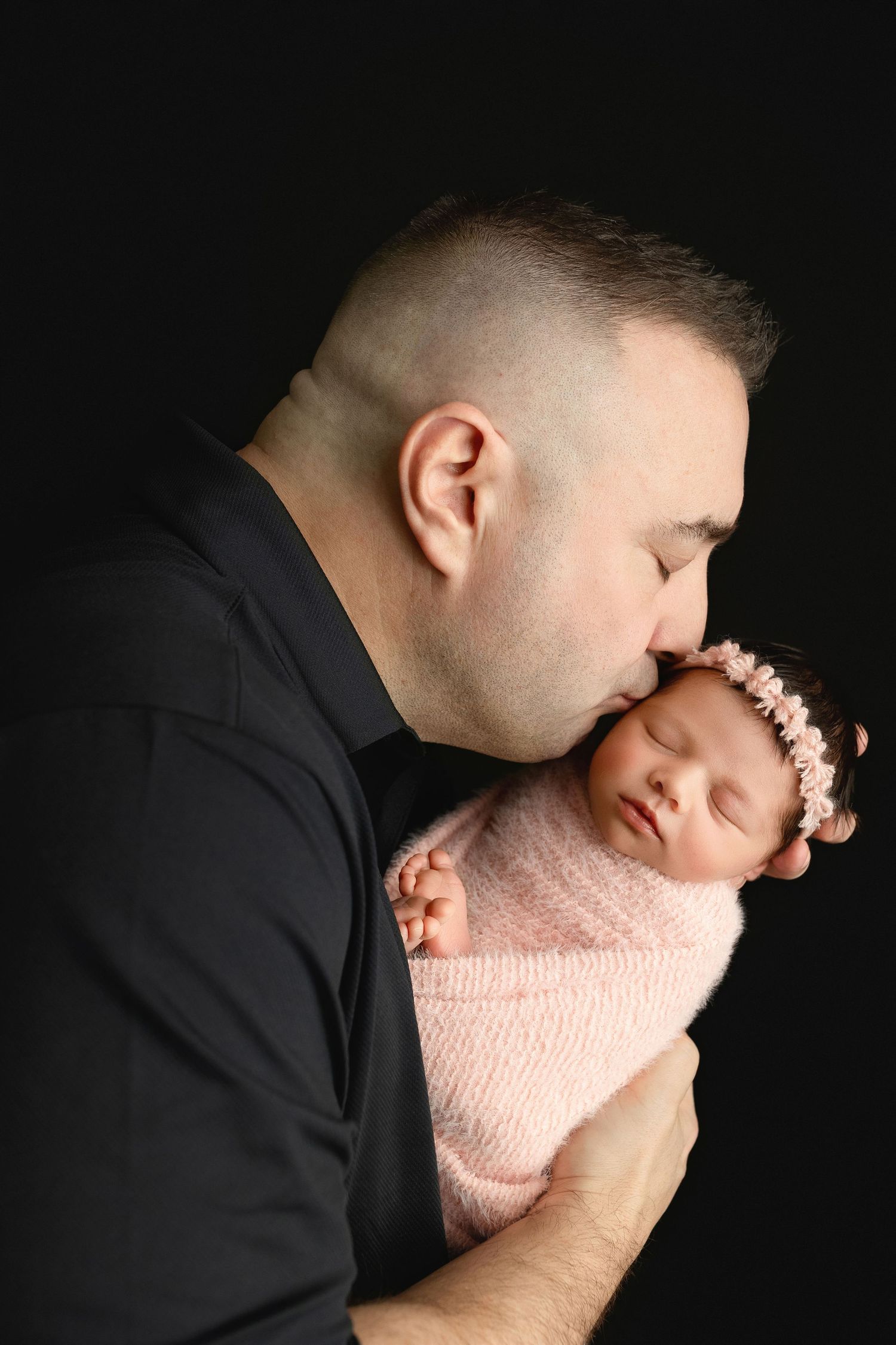 Dad kissing newborn. Greenville newborn photographer, Easley newborn photographer, Upstate newborn photographer, Greenville newborn