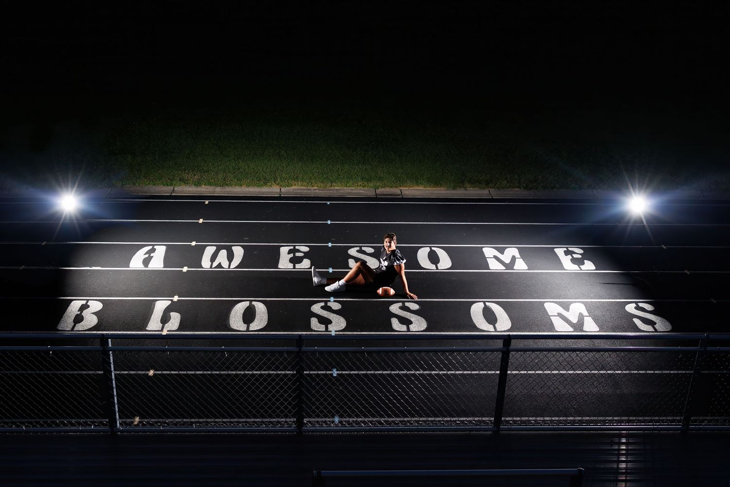 A sequence of night track photos showing a runner spelling out the word AWESOME with LED lights during long exposure.