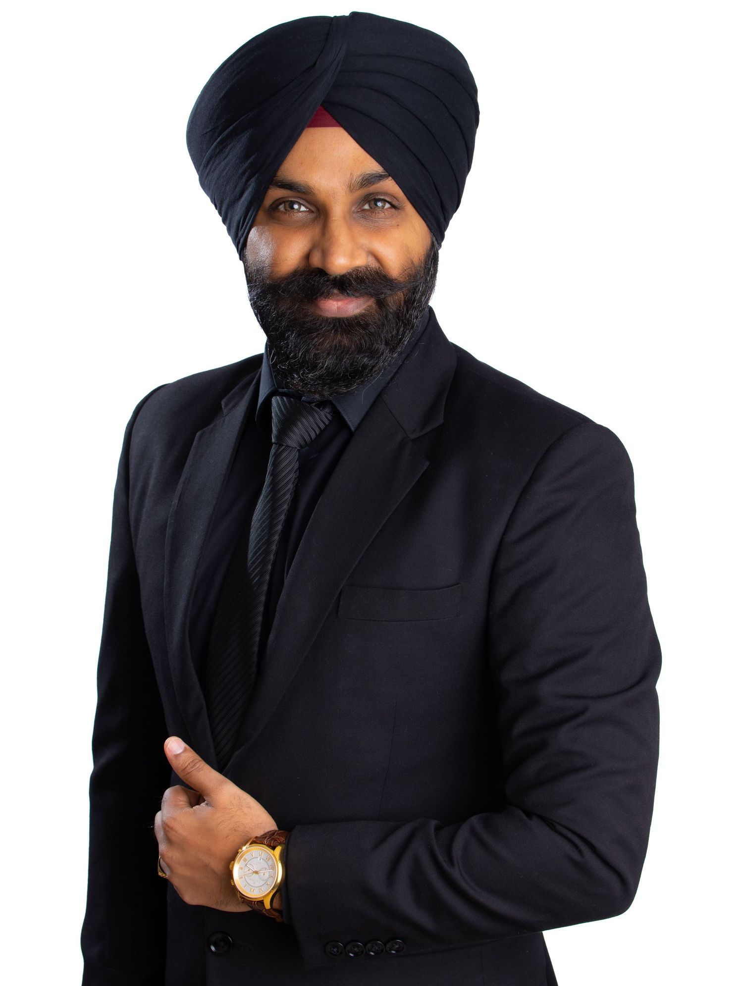 Professional portrait series of a person in a black suit and turban against dark background showing different poses.