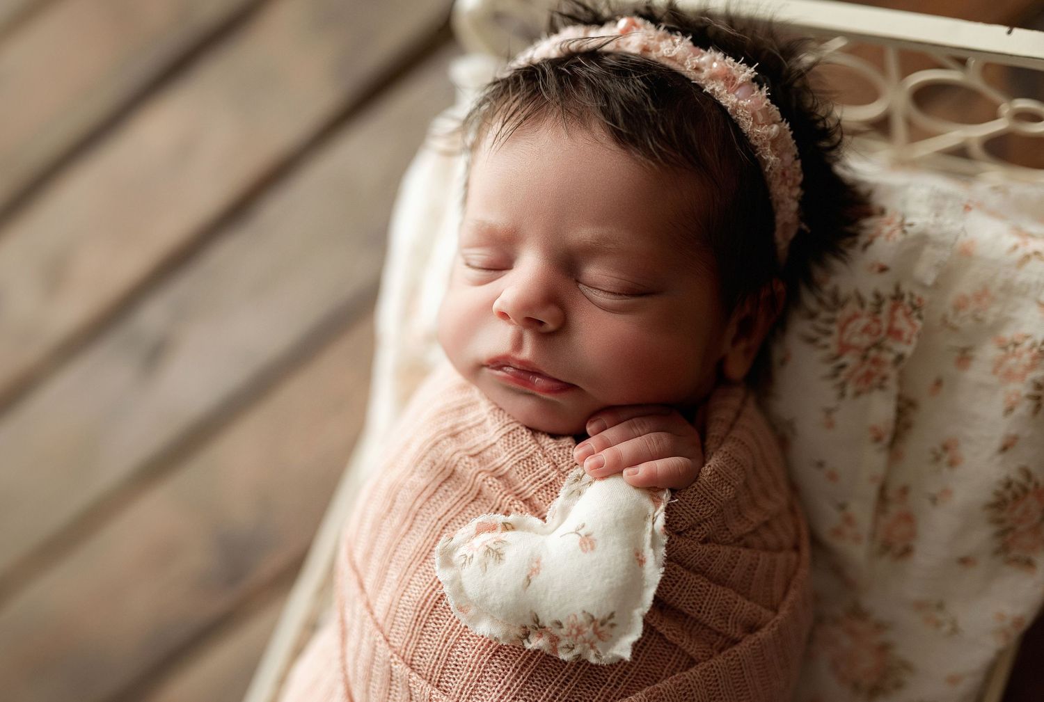 Newborn in pink holding a heart. Greenville, SC newborn photographer, Easley, SC newborn photographer, Upstate, SC newborn photographer.