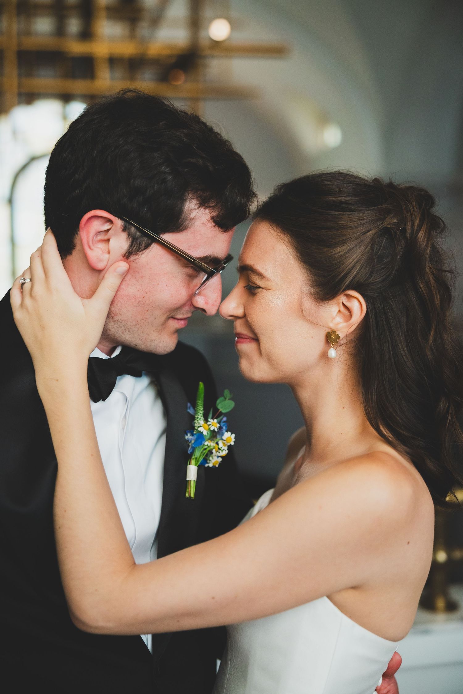 A romantic wedding moment of a bride and groom embracing each other at the Line DC