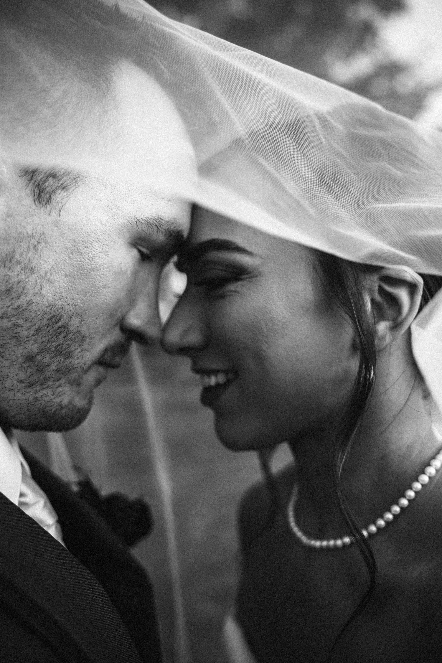 A romantic black and white photo sequence showing a couple in profile about to share an intimate kiss.