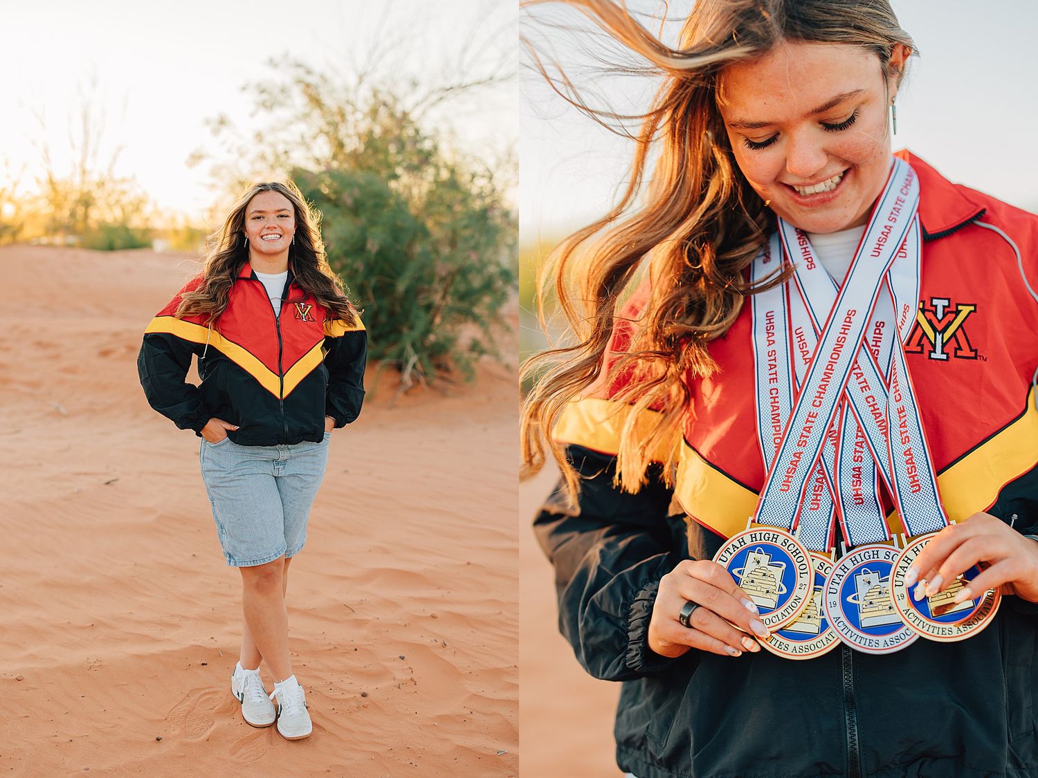 Smiling young woman in red varsity jacket proudly displaying medals on red sand dunes.