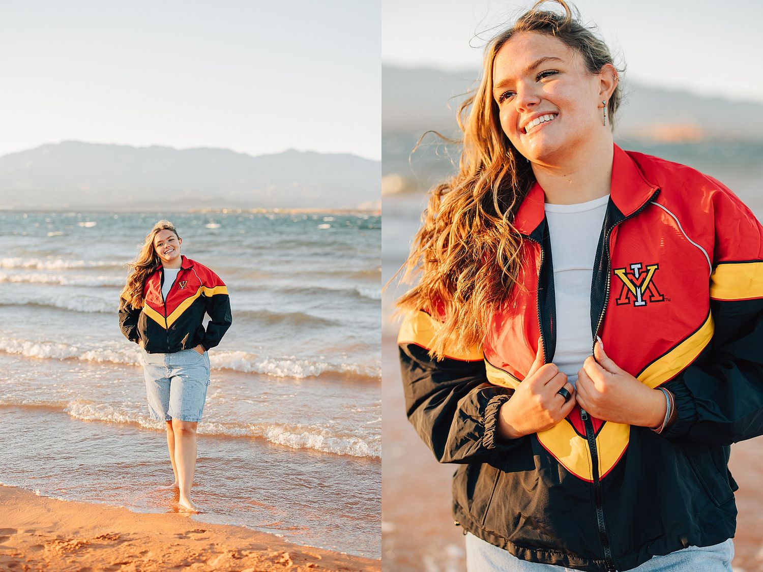 Young woman smiling on beach wearing red black and gold varsity jacket with mountains in background.