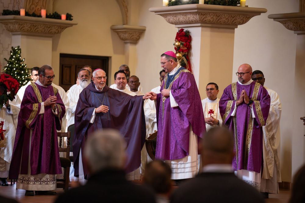 Clergy and congregation watching a bishop succession ceremony at Saint Augustine Cathedral in Tucson, by N&D Media Production.