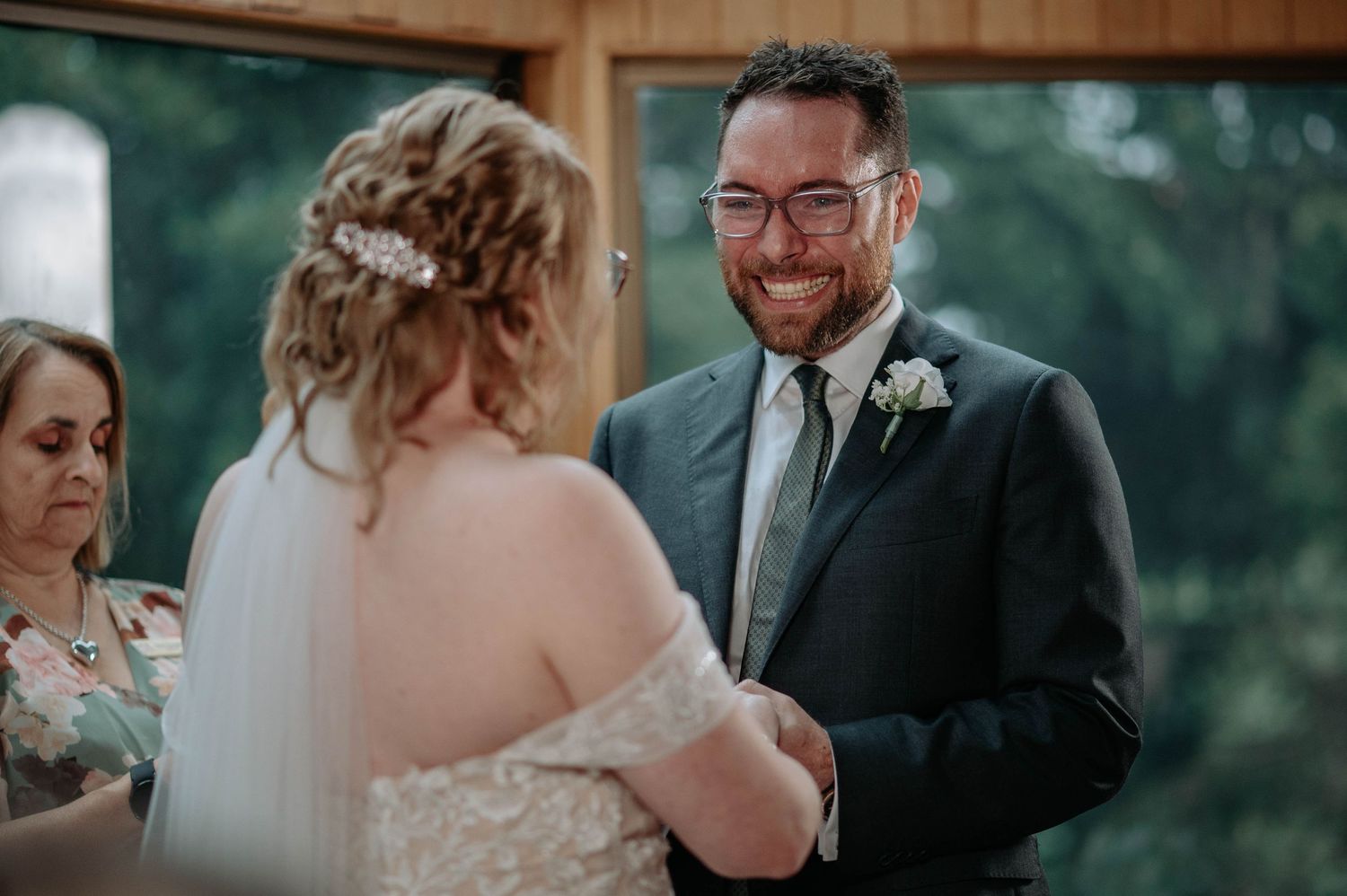 Intimate wedding ceremony moment as couple exchanges smiles and vows.