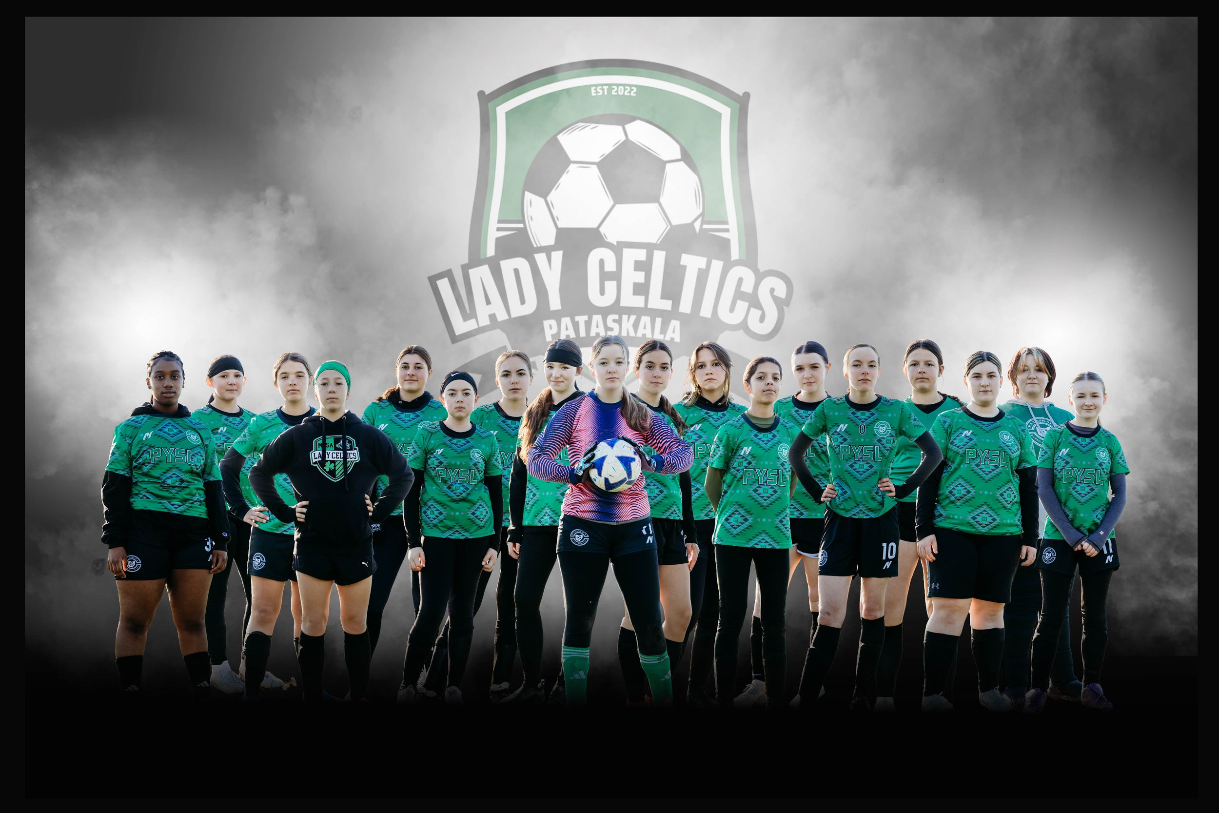 Soccer team in green jerseys poses together for team photo with Lady Celtics logo in background.