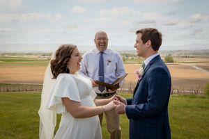 wedding ceremony with officiant all laughing with Milestones Union at Garman Hill Wilder, Idaho