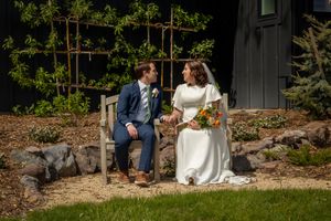 bride and groom looking at each other sitting in lawn chairs at Garman Hill Wilder, Idaho