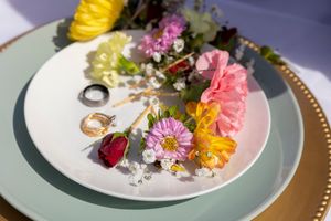 flowers and rings on plate