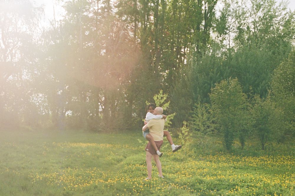 Playful interactions in a sunlit meadow during golden hour.