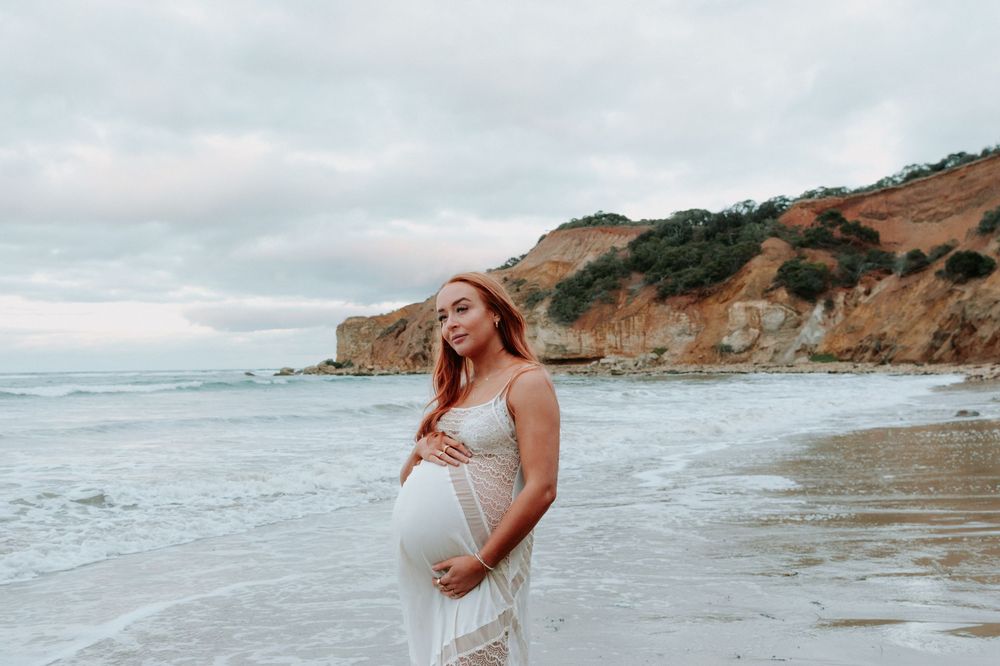 Scenic coastal landscape with dramatic cliffs and ocean waves meeting the shore.
Altona Family Photographer Melbourne