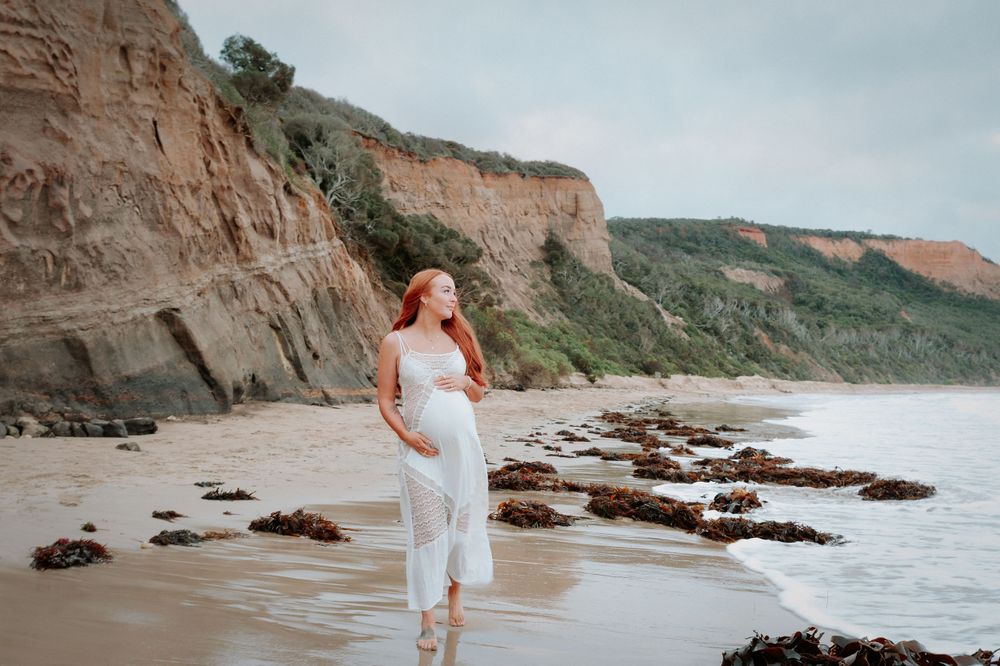 Maternity photoshoot on scenic beach with rocky cliffs and tide pools at dusk.
Altona Family Photographer Melbourne