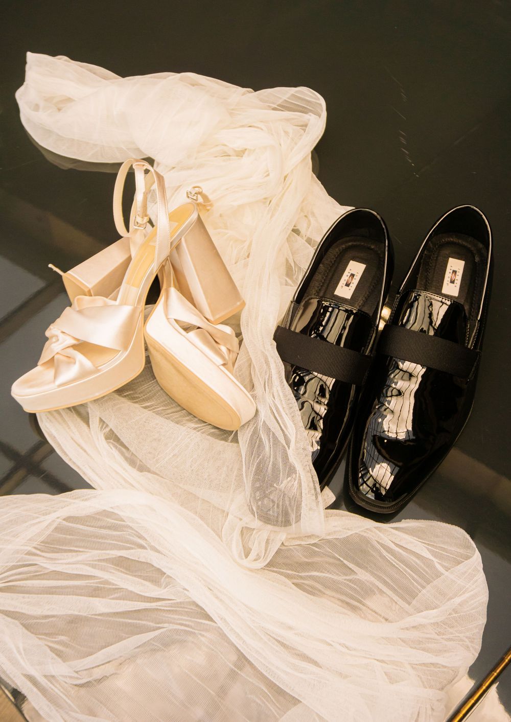 Colorado Springs Wedding Photographer. Photo of the bride and groom's shoes and veil displayed.