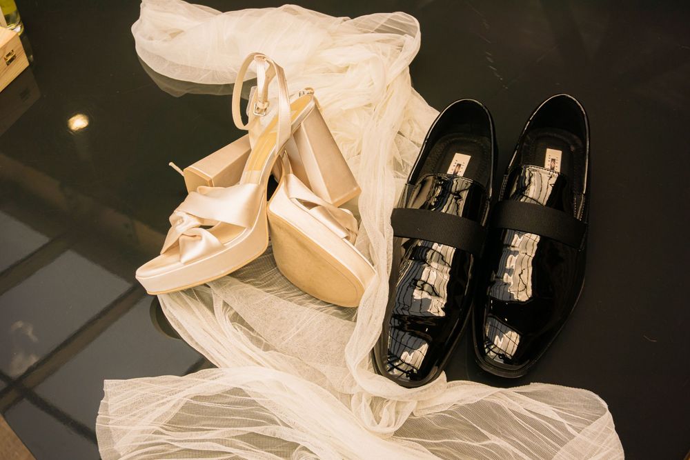Colorado Springs Wedding Photographer. Photo of the bride and groom's shoes and veil displayed.