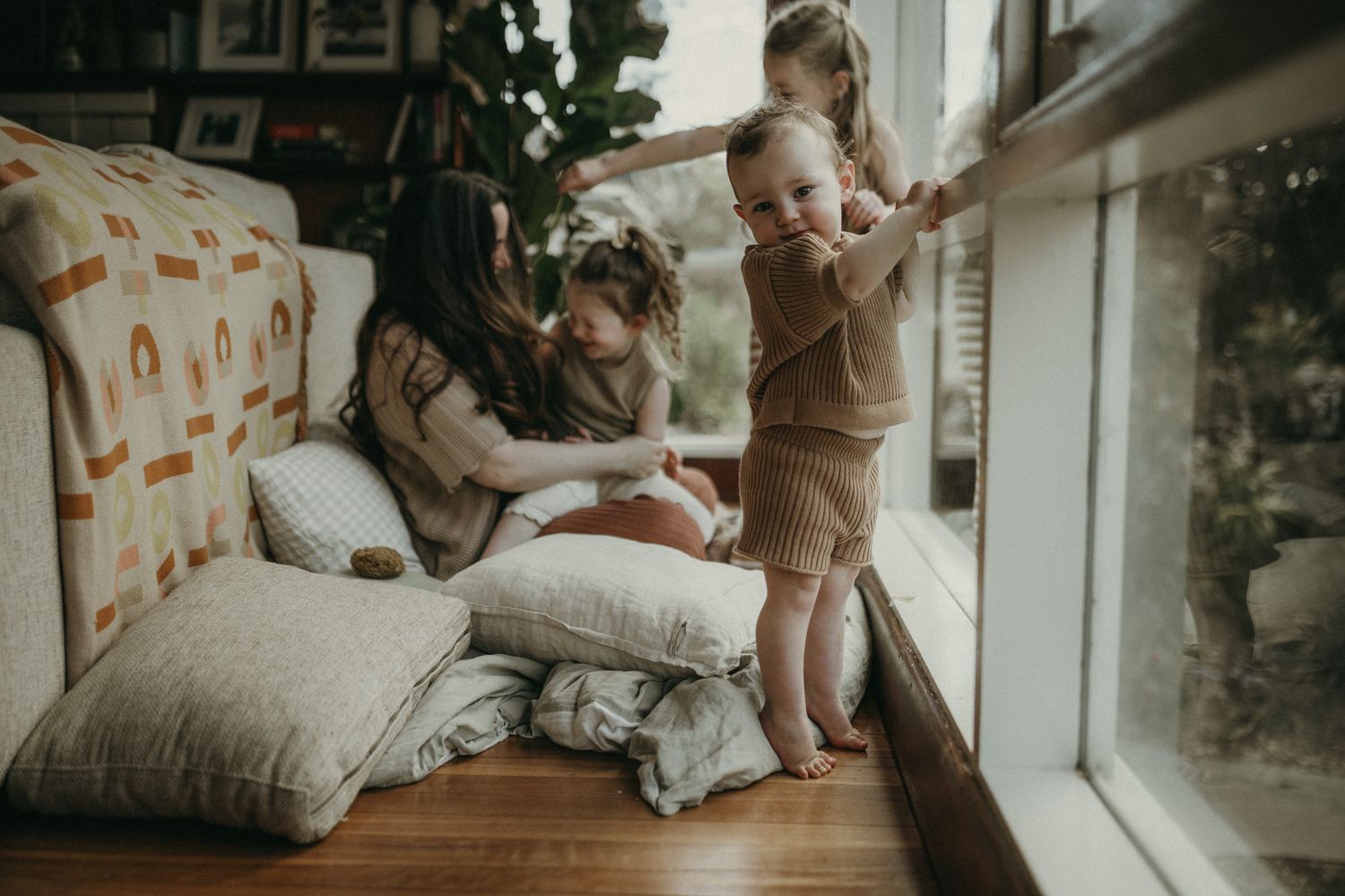 Intimate family moments captured in lifestyle newborn photography session showing tender parent-child connection at home.