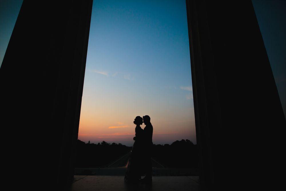 Romantic sunrise engagement at Lincoln Memorial in Washington, DC—perfect lighting and timeless love captured in silhouette.