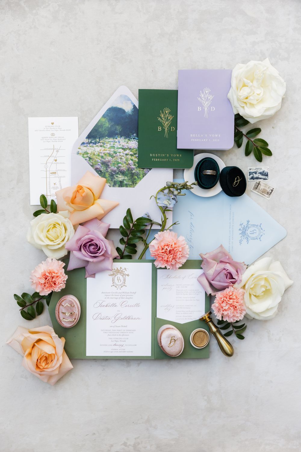 Wedding invitation suite in green and lavender with fresh flowers and elegant calligraphy.